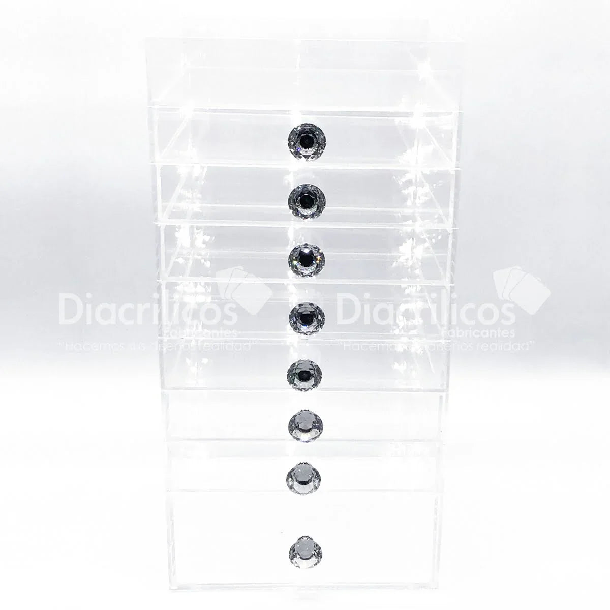 Cajonera acrílica transparente con 8 cajones y tiradores de cristal, ideal para organización de joyas o cosméticos en Colombia.